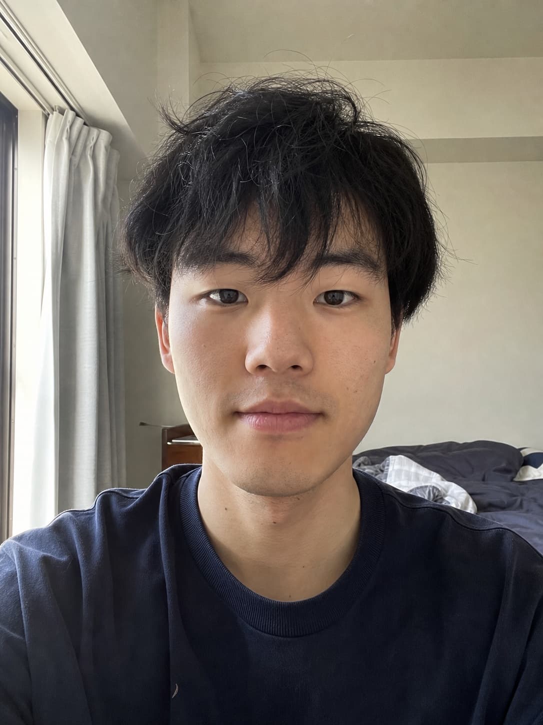 Casual selfie of a Japanese man before resume photo editing