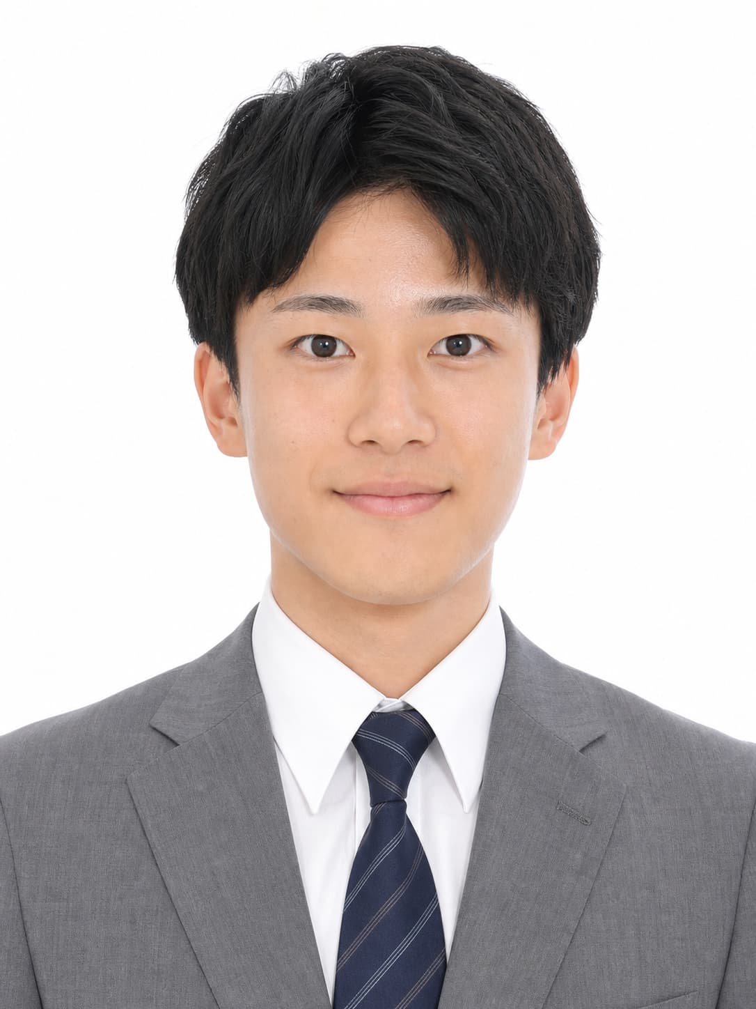 Professional resume portrait of a Japanese man in a gray suit