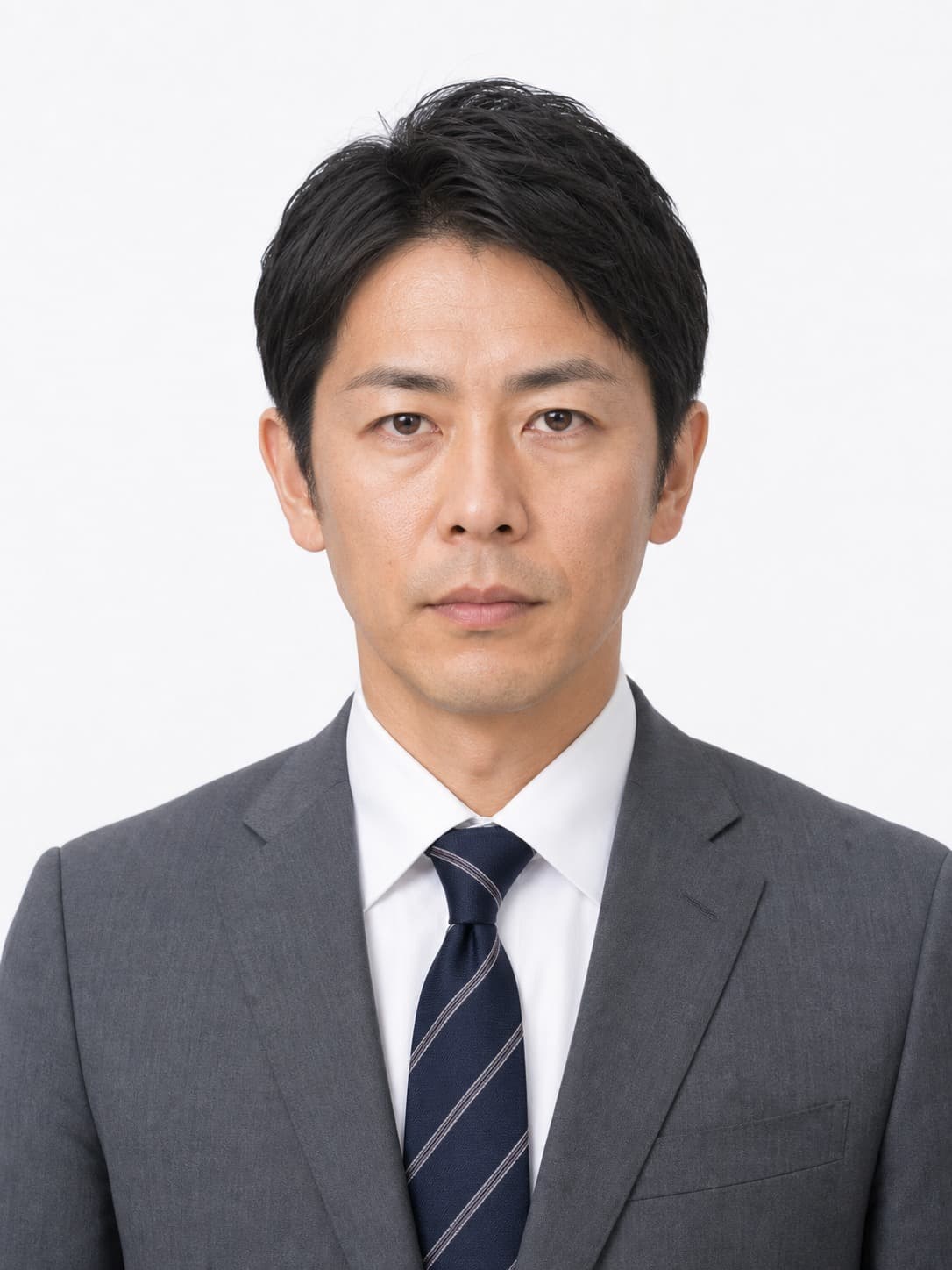 Japanese man in a gray suit on a white background